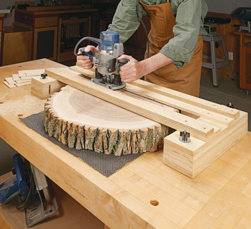 You can build a k easily with the methods explained in Woodsmith. 
It is built from plywood which is cut according to the size of the lumber slabs and tree slices.https://www.woodsmith.com/article/router-leveling-jig/