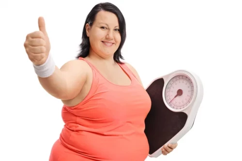 depositphotos 165468666 stock photo overweight woman with weight scale