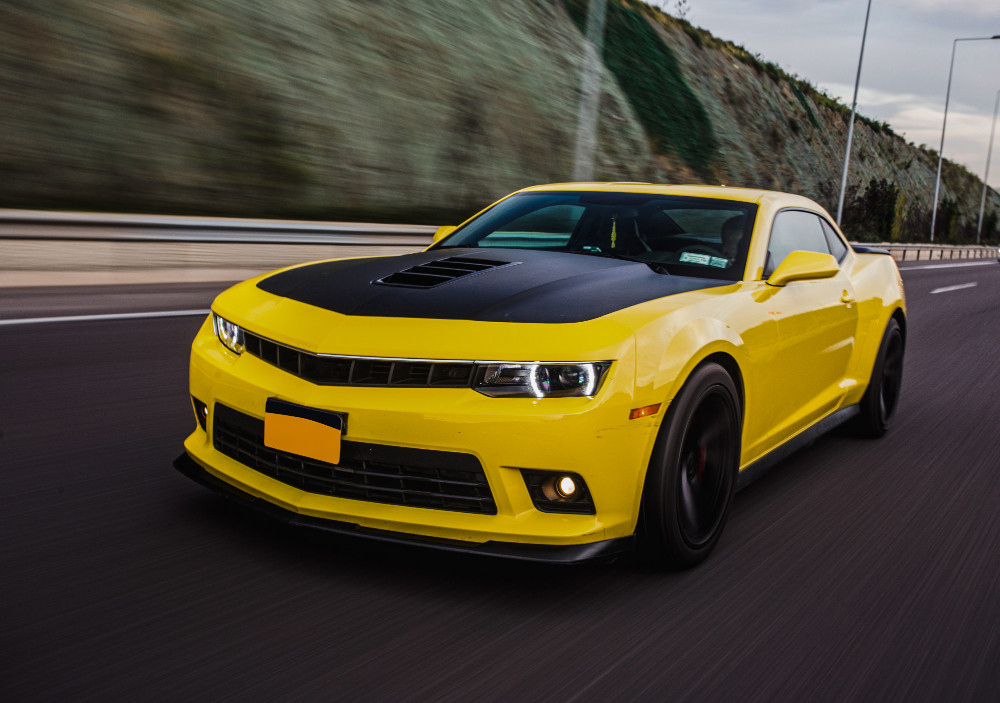 yellow sport car with black autotuning road