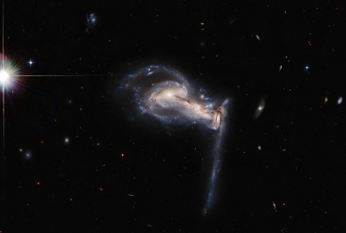 A dramatic triplet of galaxies takes centre stage in this latest Picture of the Week from the NASA/E